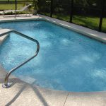 inground pool in a backyard
